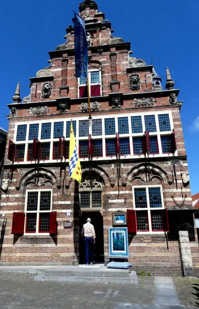 Woerden 12 20210606 voorkant gebouw recht voor voren Drukkerij in